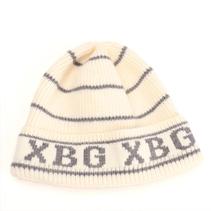 Close-up of knit beanie texture showing grey striped pattern and XBG letter embroidery