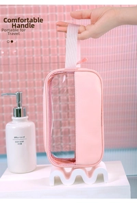 Detail of pink waterproof makeup bag with durable handle and transparent PVC panel
