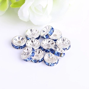 Detail shot of silver crystal spacer beads with blue rhinestones for DIY jewelry making