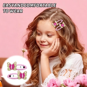 Detail of pink and gold glitter butterfly hair clips worn by a young girl with magenta accents
