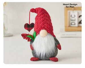 Close-up of heart-themed male Christmas gnome with red knit hat and white beard detail