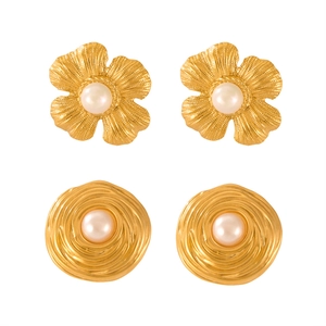 Vintage gold plated geometric earrings set with pearl flowers and spiral patterns