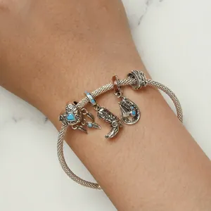S925 sterling silver cowboy boot and horseshoe charm bracelet on wrist