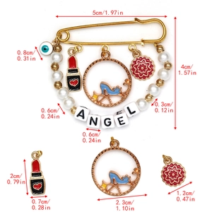 Detailed dimension guide for evil eye brooch featuring pearls and ANGEL letter charms