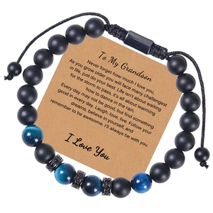 Detail of matte tiger eye beads and braided cord bracelet with grandson greeting card
