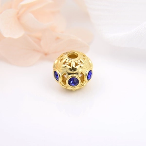 Hollowed 18k gold plated round bead with inlaid blue crystals for DIY jewelry making