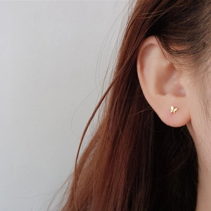 Elegant gold butterfly stud earrings for women crafted in a minimalist fashion style