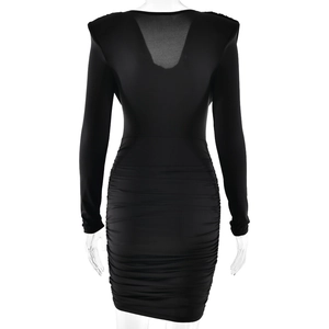 Detail view of the black V-back long sleeve dress with elegant ruched fabric details