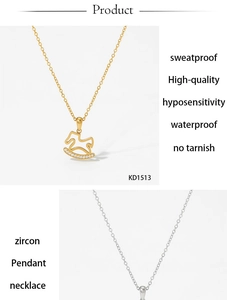 Detail of gold and silver rocking horse pendant necklaces featuring sparkling zircon stones