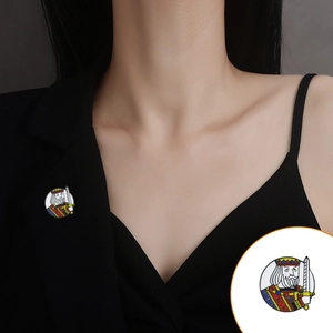 Cartoon King enamel lapel pin on black suit jacket with detailed product close-up view