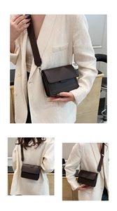 Detail view of a dark brown square crossbody bag with wide canvas strap and matte finish