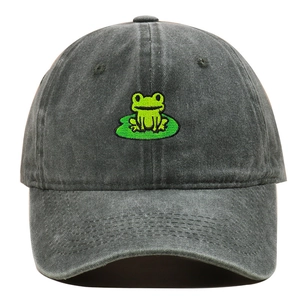 Detail of green frog embroidery on vintage washed grey denim cotton baseball cap