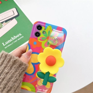 Floral iPhone case with 3D yellow flower ornament and clear functional wrist strap