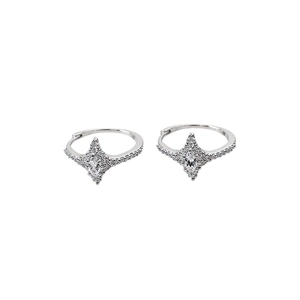 Silver star-shaped zircon huggie earrings with a minimalist celestial design