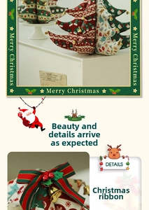 Detail of Christmas fabric tree with bells and reindeer pattern on cotton linen material