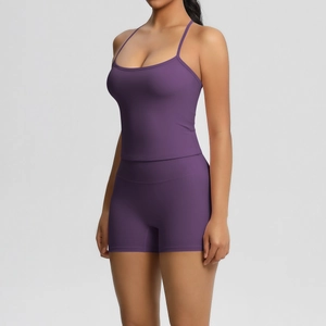 Detail of dark purple racerback yoga top and high-waist fitness shorts in brushed fabric