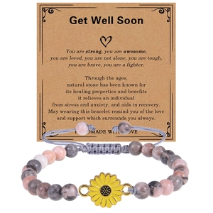 Detail of 6mm mahogany stone bracelet with sunflower charm on a Get Well Soon card