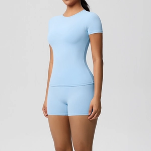Detail of light blue high-stretch yoga set featuring seamless knit fabric and bodycon fit
