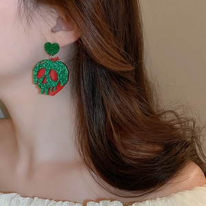Detailed view of Halloween poison apple earrings with green glitter and red acrylic finish