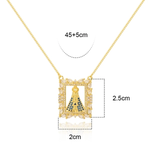 Detail of 18K gold plated Virgin Mary pendant with blue and clear zircon stones