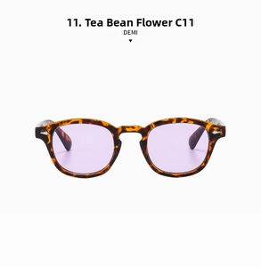 Close-up of retro tortoiseshell frame with metal rivets and light purple lenses