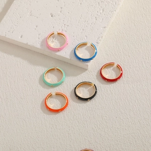 Colorful enamel hoop earrings with gold base in vibrant dopamine fashion style