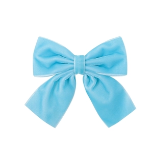 Close-up of light blue velvet bow clip showing soft fabric texture and stitching detail