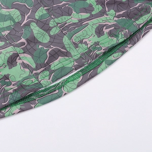 Macro shot showing reinforced double-needle stitching on camo printed elastic crop top