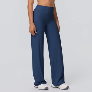 Side view of dark blue high-waisted yoga flare pants showing premium brushed fabric texture