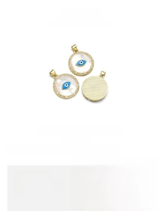 Detailed view of evil eye shell pendant with gold plating and pearl bead details