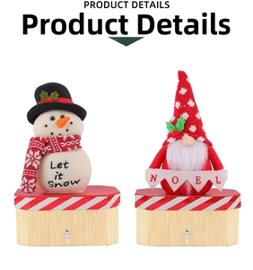 Detail of Santa and Snowman wood gift boxes with Noel banner and festive text