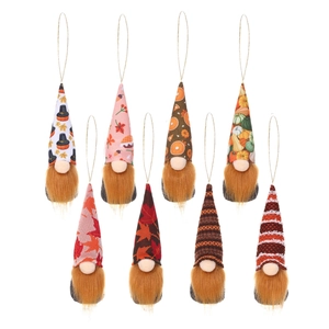 Set of 8 autumn gnome ornaments with pumpkin and maple leaf patterns on white background
