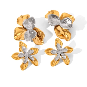 Two-tone hammered metal flower earrings in gold and silver finish on white background