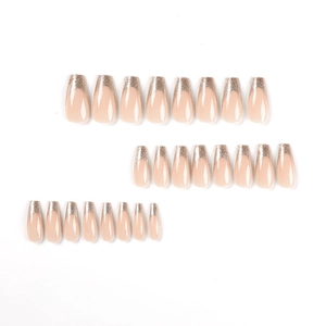Press on nails set featuring nude pink base with silver and gold glitter French tips