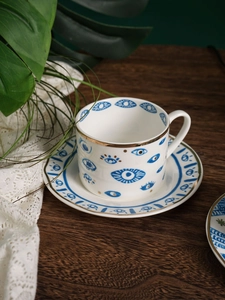 Set tazzina da caffè e piattino nordico in ceramica con motivi malocchio blu