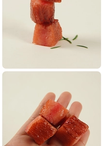 Macro detail of realistic faux beef cubes keychain showing texture and oily finish