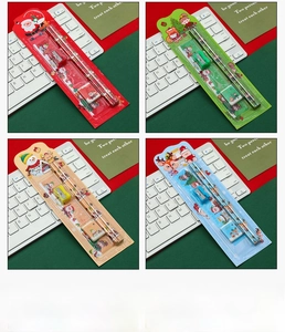 Close-up of 5-piece Christmas stationery sets with festive Santa and reindeer illustrations
