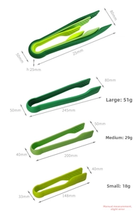Three sizes of green plastic kitchen tongs for baking bread and serving food