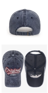 Detail view of washed navy baseball cap featuring 3D embroidery and vintage metal buckle