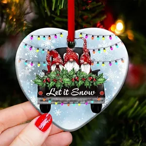Flat acrylic heart gnome Christmas ornament featuring Let it Snow text on a tree