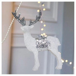 Detail of white Christmas reindeer hanging ornament with silver glitter accents and string