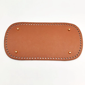 Brown oval PU leather crochet bag base with pre-drilled holes and metal feet details