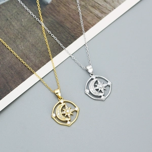 Detail showing S925 sterling silver stamp on celestial moon and star pendant necklace