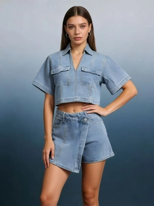 Front view of light blue denim two-piece set with cropped top and asymmetric skort