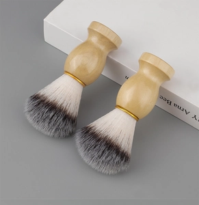 Close-up of shaving brushes with ergonomic wood handles and soft bionic synthetic bristles