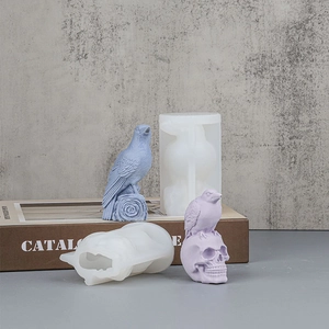 DIY silicone mold featuring a raven perched on a skull and wood post for candle making
