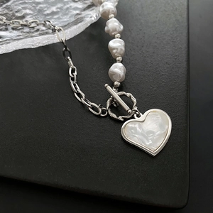 Elegant heart pendant pearl necklace with silver chain and T-bar toggle clasp design