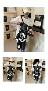Detailed views of a black bear-shaped PU leather backpack with white skeleton design
