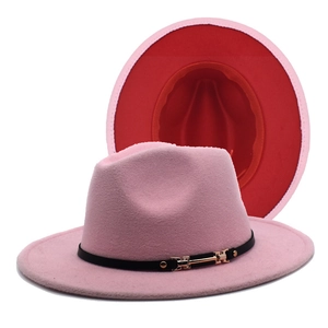 Close-up of pink and red bicolor fedora with black belt and golden metal buckle