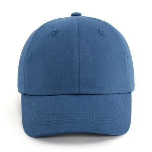 Detailed macro view of navy blue cotton twill baseball cap fabric and stitching